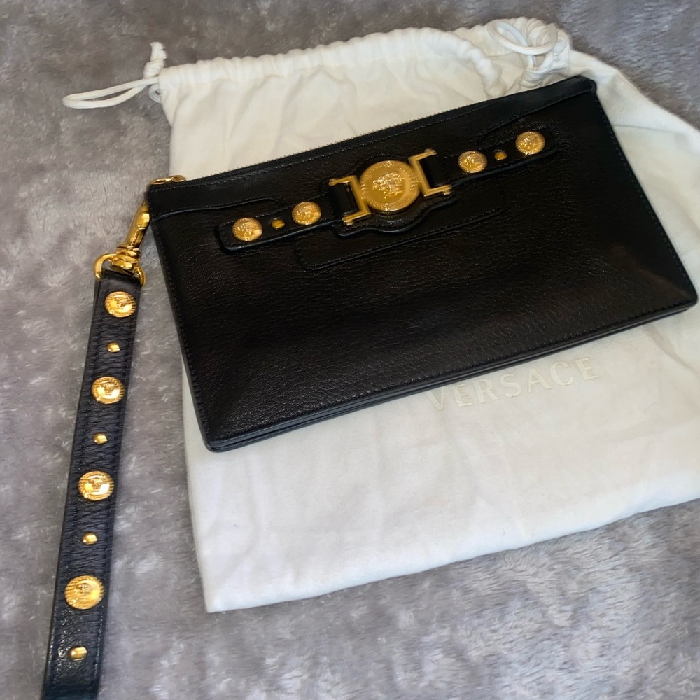 Black and gold Versace wristlet. Great condition